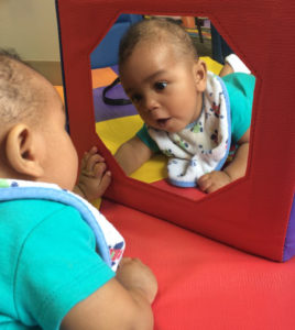 baby boy discovers his reflection